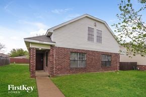 Dallas house for rent - a brick and with a sidewalk and grass