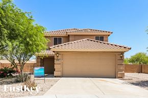Buckeye house for rent - A house with a brown roof and a garage door.