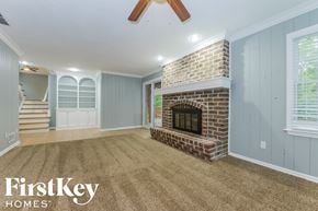 Overland Park house for rent - the living room has a brick fireplace and a carpeted floor