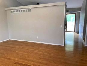 Saint Peters house for rent - an empty living room with white walls and wood floors