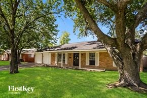 La Porte house for rent - A house with a tree in front of it.