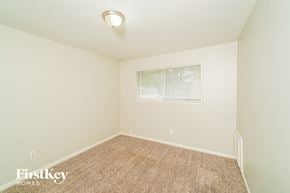 La Porte house for rent - a spacious room with carpet and a window