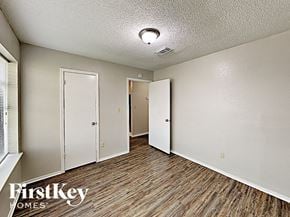 Houston house for rent - a living room with wood flooring and white walls and doors