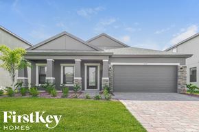 Melbourne house for rent - a house with a driveway and lawn in front of it