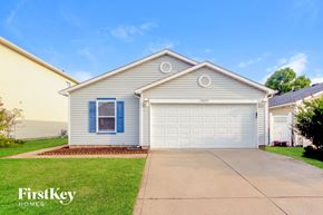 Camby house for rent - A two-car garage is attached to a house.