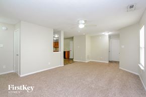 Camby house for rent - A spacious empty room with a carpeted floor and white walls.
