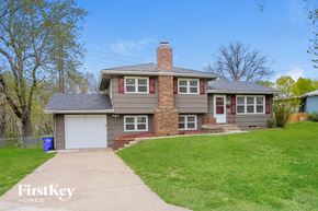 Shawnee house for rent - a brown and with a garage and a lawn