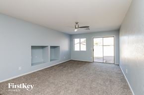 San Tan Valley house for rent - a bedroom with a carpeted floor and a ceiling fan