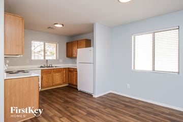 San Tan Valley house for rent - a kitchen with wood flooring and a white refrigerator
