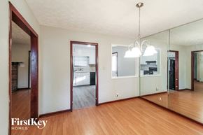 Lawrenceville house for rent - a living room with a mirror and a wooden floor