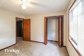 Lawrenceville house for rent - a bedroom with a closet and a window and a door