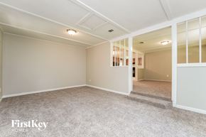 Conyers house for rent - A spacious room with a carpeted floor and a white ceiling.