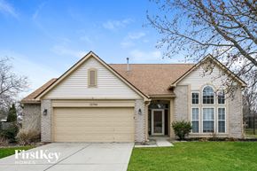 Fishers house for rent - A house with a garage and a driveway is for sale.
