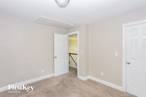 Charlotte house for rent - a bedroom with two closets and a door to a hallway