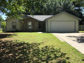 Hampton house for rent - a white house with a lawn and a garage