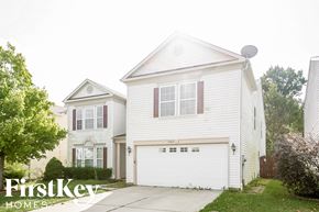 Indianapolis house for rent - a white house with a white garage door