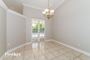 Miami house for rent - a formal dining room with a door to the pool