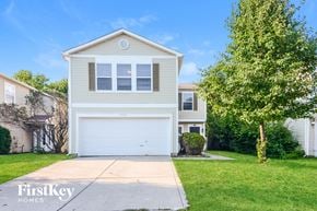 Camby house for rent - A two-story house with a garage is for sale.