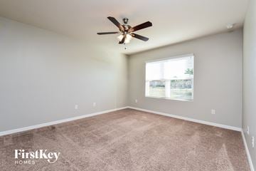 Cape Coral house for rent - the spacious living room with ceiling fan and carpet