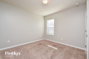 Cape Coral house for rent - a spacious room with carpet and a window