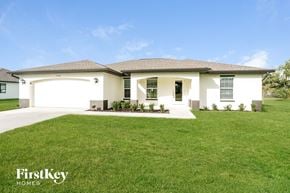Cape Coral house for rent - a house with a lawn in front of it