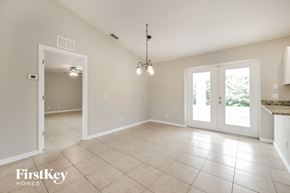 Englewood house for rent - an empty living room with a door into the kitchen