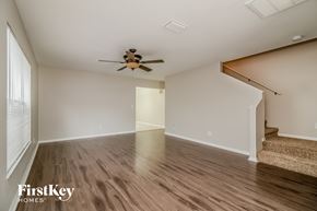 Riverview house for rent - a living room with hardwood floors and a ceiling fan