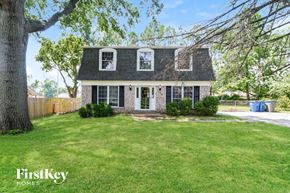 Saint Louis house for rent - a house with a lawn and a tree
