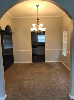 Mcdonough house for rent - A room with a chandelier and a black cabinet.