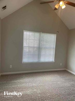 Hampton house for rent - a bedroom with a window and a ceiling fan