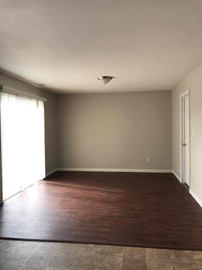 Indianapolis house for rent - A room with a brown floor and a white ceiling.