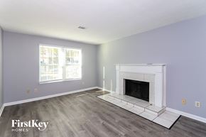 Alpharetta house for rent - the living room has a fireplace and hardwood floors