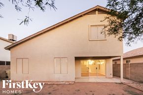 Glendale house for rent - the exterior of a white house with a driveway and a door