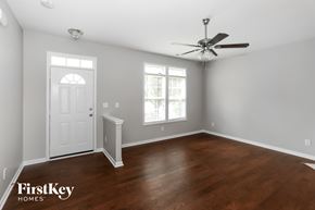 Cornelius house for rent - A room with a wooden floor and a ceiling fan.