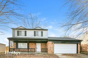 Indianapolis house for rent - A two-story house with a garage is for sale.