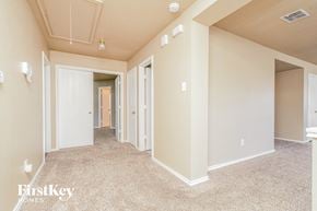 Cedar Hill house for rent - a spacious living room with a carpeted floor and several closets