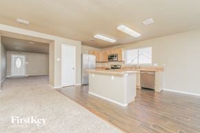 Cedar Hill house for rent - a kitchen and living room with a refrigerator and a sink