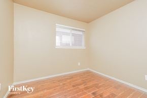 Cedar Hill house for rent - a bedroom with wood floors and a window