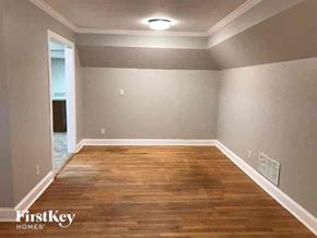 Jacksonville house for rent - a empty room with a wood floor and gray walls