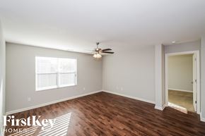 Vance house for rent - a living room with wood flooring and a ceiling fan