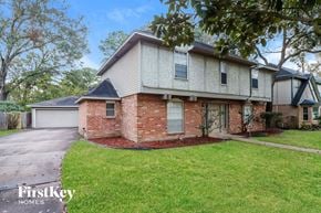 Houston house for rent - a brick and with a yard and a sidewalk