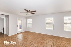 El Mirage house for rent - a living room with a ceiling fan and a tile floor