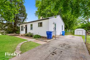 Florissant house for rent - A house with a driveway and a garage is for sale.