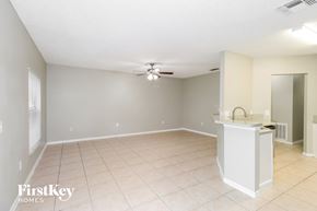 Sebastian house for rent - A spacious room with a kitchen island and a ceiling fan.