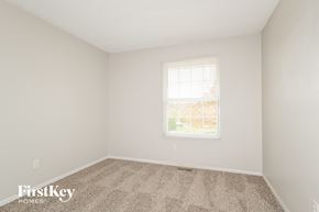 Black Jack house for rent - a bedroom with carpet and a window
