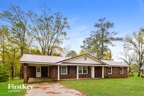 Covington house for rent - front view of a brick house with a metal roof