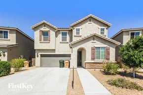 Peoria house for rent - A large house with a driveway in front of it.