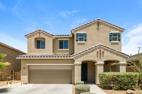 Peoria house for rent - a house with a garage door in front of it