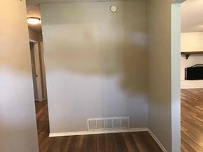 Flower Mound house for rent - an empty room with a wall and a heater