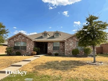 Lancaster house for rent - a brick house with a tree in front of it